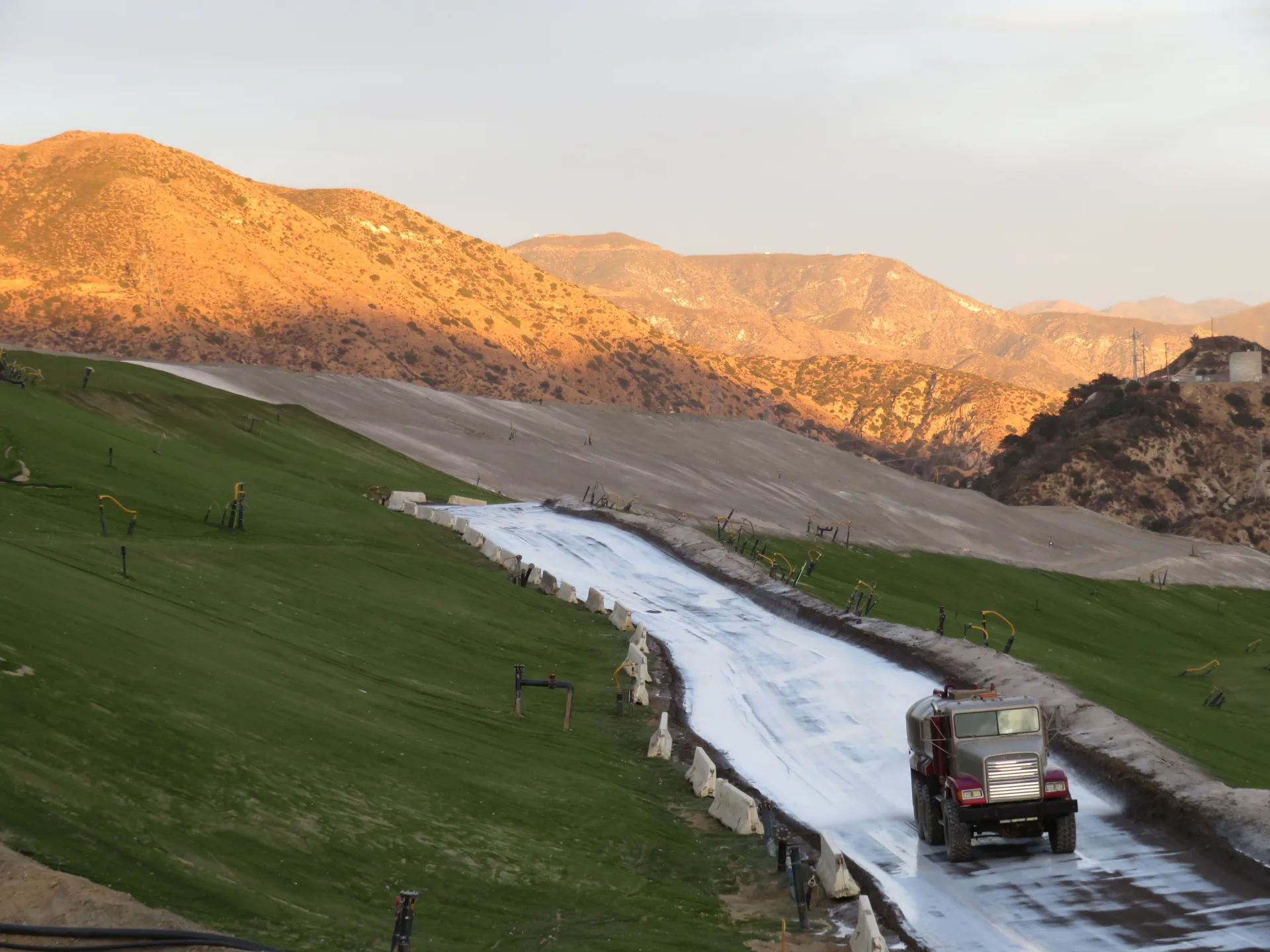 LL-TEQ tanker applying polymer emulsion on Sunshine Canyon landfill hillside access road